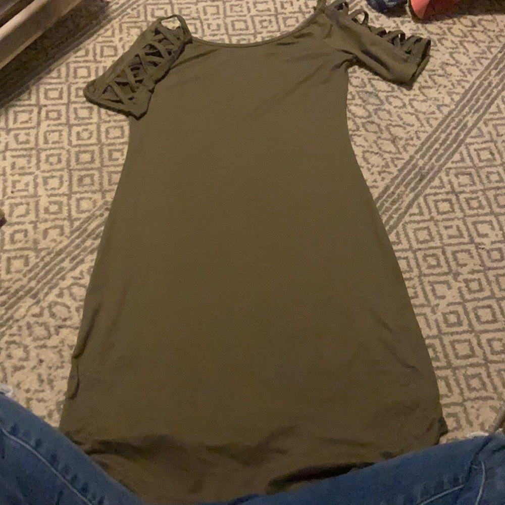 a dark green dress ( crossed sleeves )